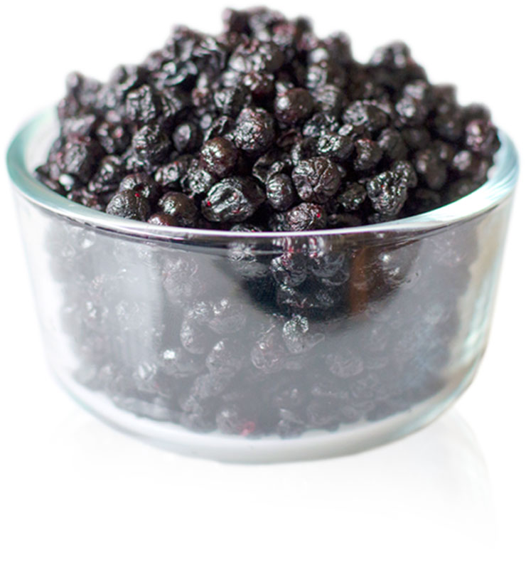 A glass bowl filled with dried chewy wild blueberries.