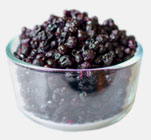 A glass bowl filled with chewy wild blueberries.